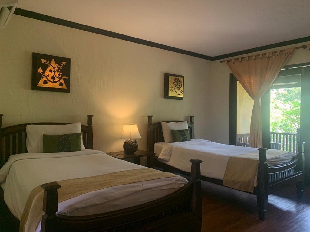 Postel nebo postele na pokoji v ubytování Seashell Resort Koh Tao-SHA Plus
