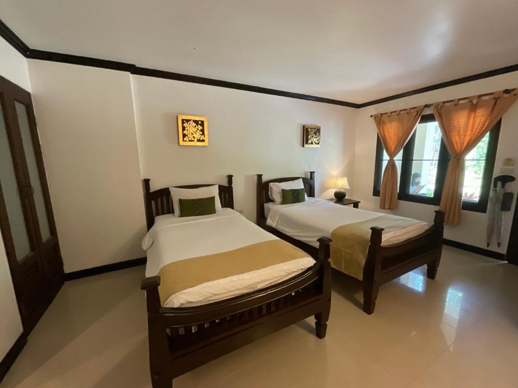 Postel nebo postele na pokoji v ubytování Seashell Resort Koh Tao-SHA Plus