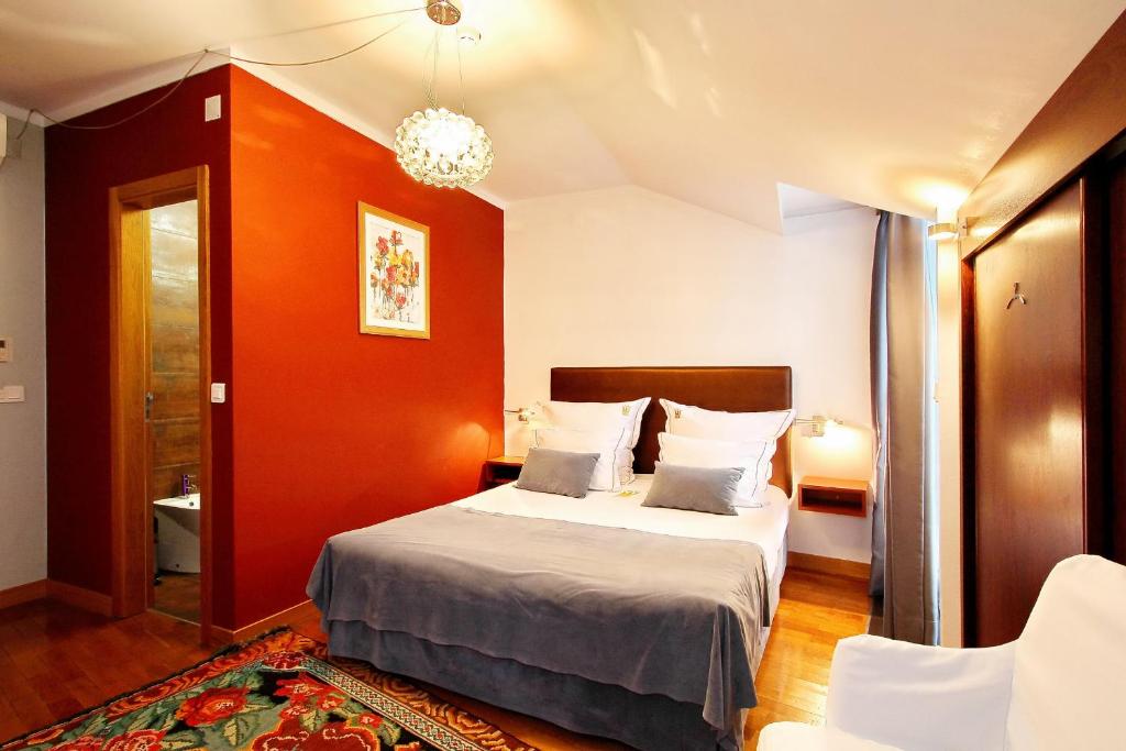 Postel nebo postele na pokoji v ubytování Hotel Mestre de Avis