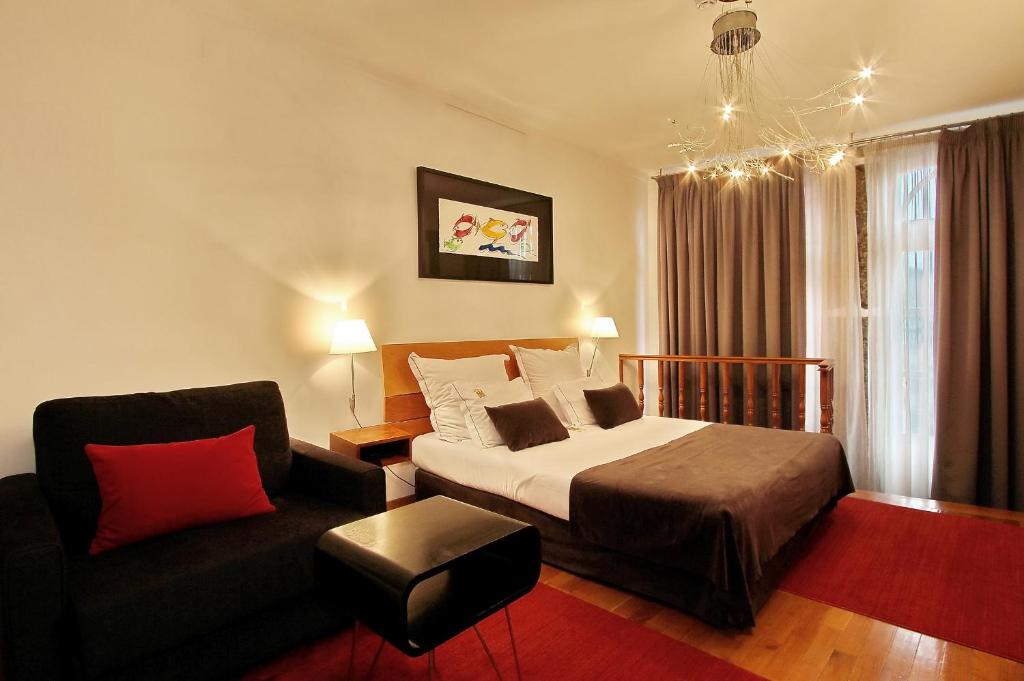 Postel nebo postele na pokoji v ubytování Hotel Mestre de Avis