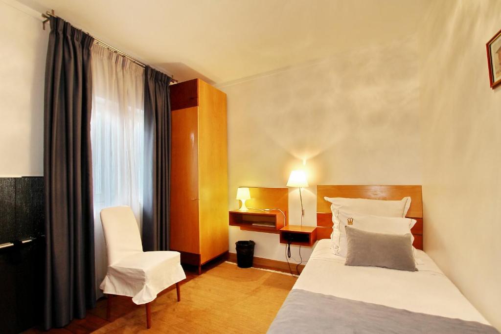 Postel nebo postele na pokoji v ubytování Hotel Mestre de Avis
