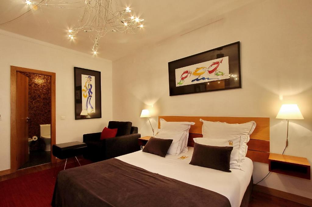 Postel nebo postele na pokoji v ubytování Hotel Mestre de Avis