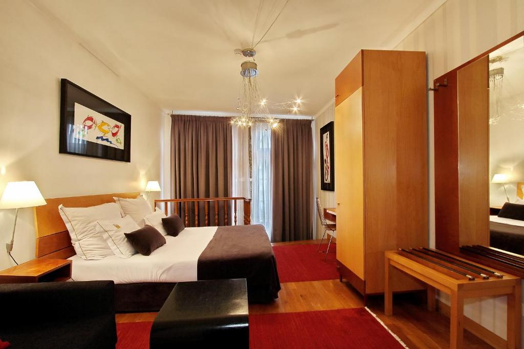 Postel nebo postele na pokoji v ubytování Hotel Mestre de Avis