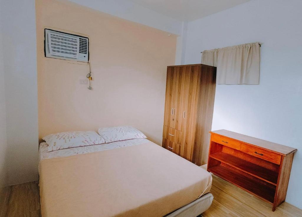 Postel nebo postele na pokoji v ubytování Bridgeview Residences