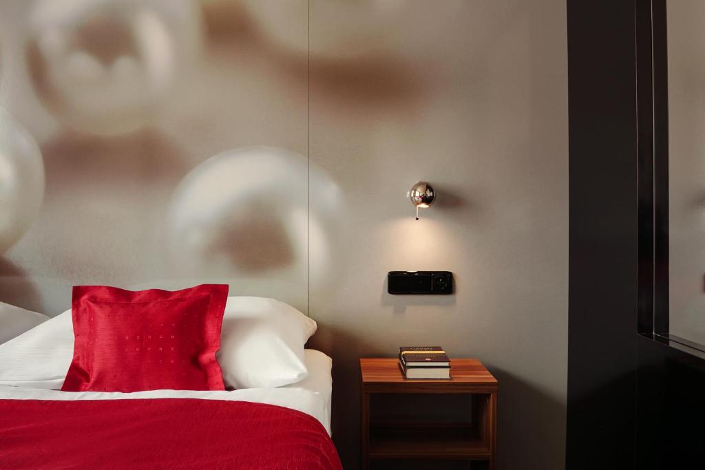 Postel nebo postele na pokoji v ubytování Perla Hotel