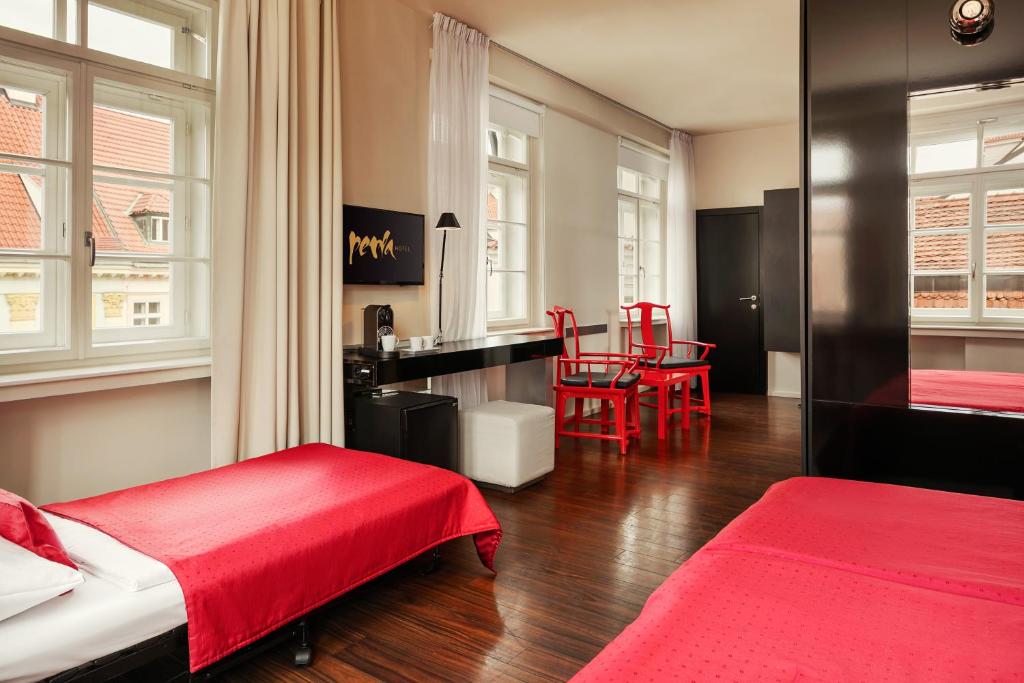 Postel nebo postele na pokoji v ubytování Perla Hotel