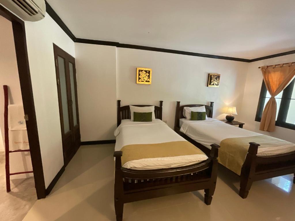 Postel nebo postele na pokoji v ubytování Seashell Resort Koh Tao-SHA Plus