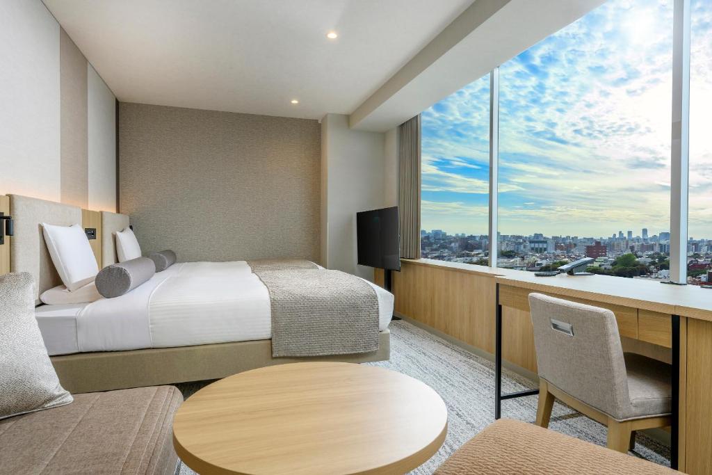 Postel nebo postele na pokoji v ubytování ART HOTEL Nippori Lungwood