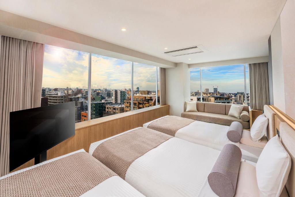 TV a/nebo společenská místnost v ubytování ART HOTEL Nippori Lungwood