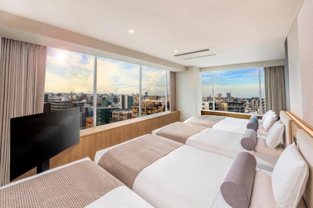 TV a/nebo společenská místnost v ubytování ART HOTEL Nippori Lungwood