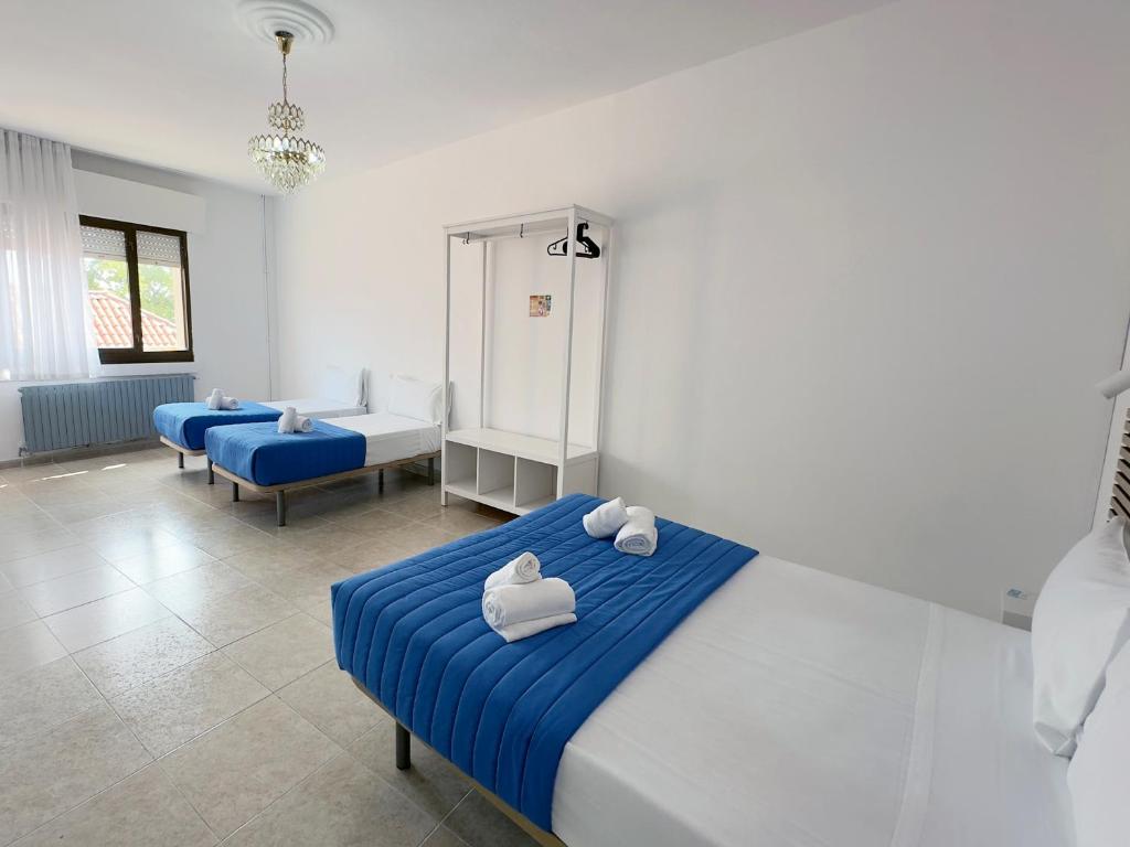 Cama o camas de una habitación en Complejo Tamanaco Illa de Arousa 3000