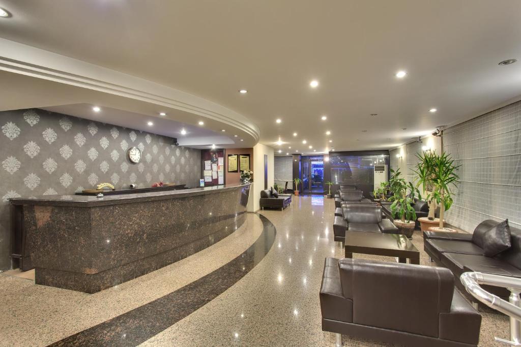 a hotel lobby with couches and a pool table at Antroyal Hotel in Antalya