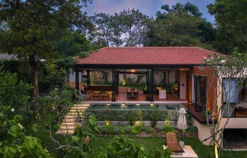 a small house with a garden and a house at The Garden Pavilion in Colombo