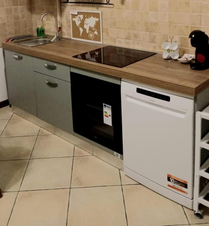 Kuchyň nebo kuchyňský kout v ubytování LaelleApartament Rho Fiera San Siro