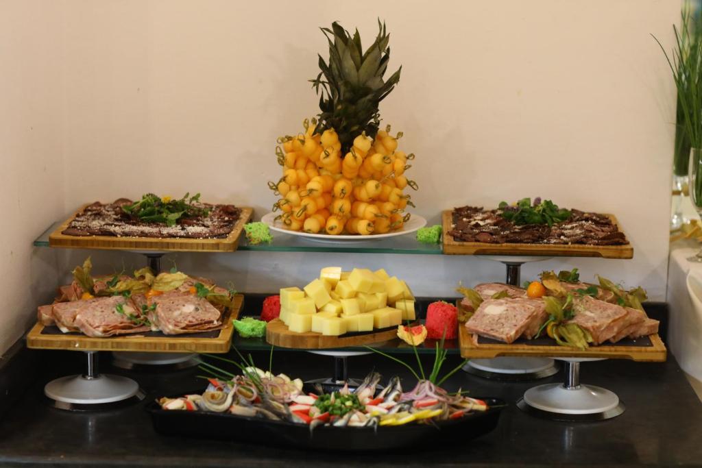 a buffet of different types of food on plates at Arena Mar Hotel and SPA in Golden Sands