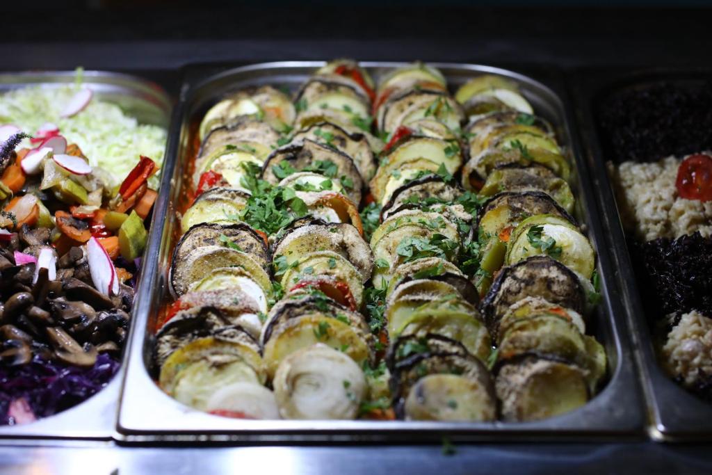 a tray of food with sushi and other foods at Arena Mar Hotel and SPA in Golden Sands