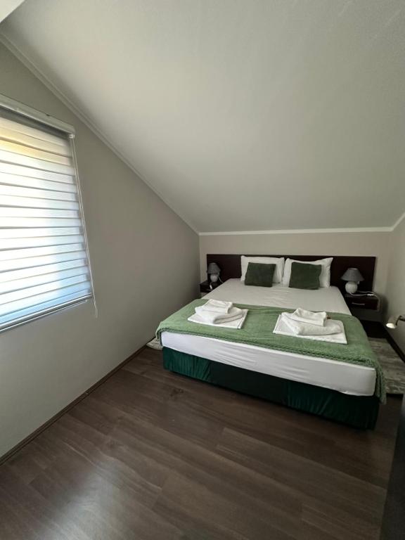 Postel nebo postele na pokoji v ubytování Fenix Apartments