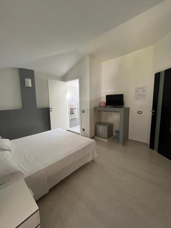 Postel nebo postele na pokoji v ubytování Bella Vita Guesthouse -parcheggio privato interno