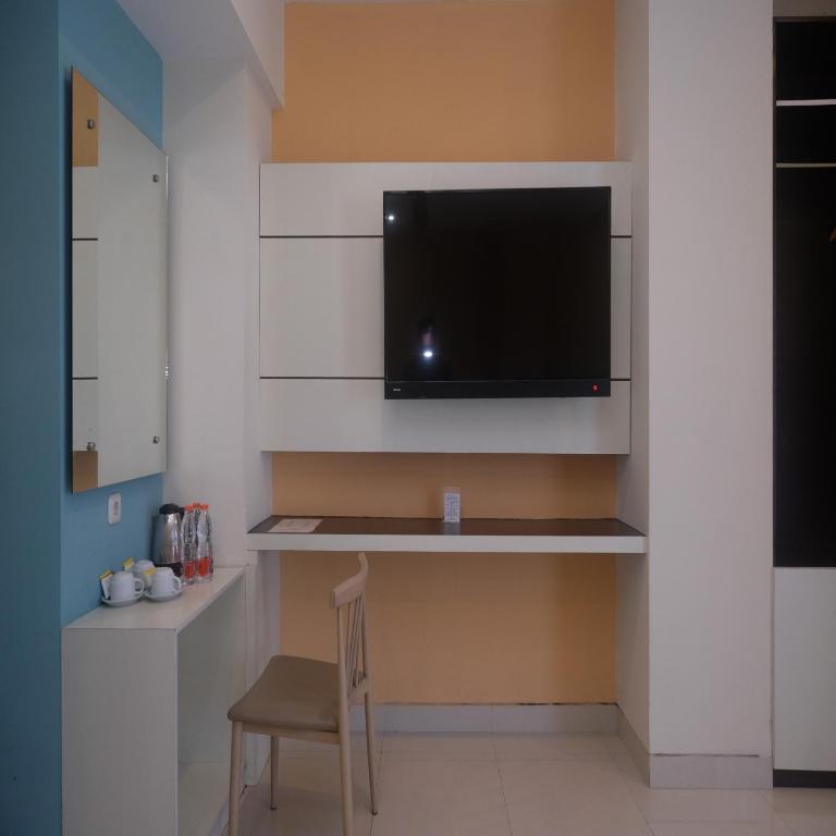 Kuchyň nebo kuchyňský kout v ubytování Sans Hotel Nagari Malioboro
