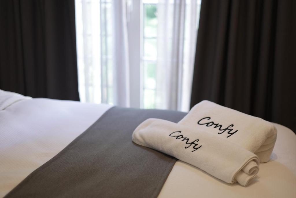 Postel nebo postele na pokoji v ubytování Comfy apart hotel
