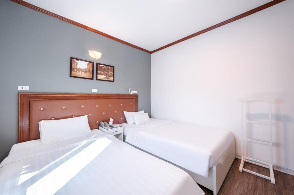 Postel nebo postele na pokoji v ubytování A25 Hotel - 185 Lò Đúc