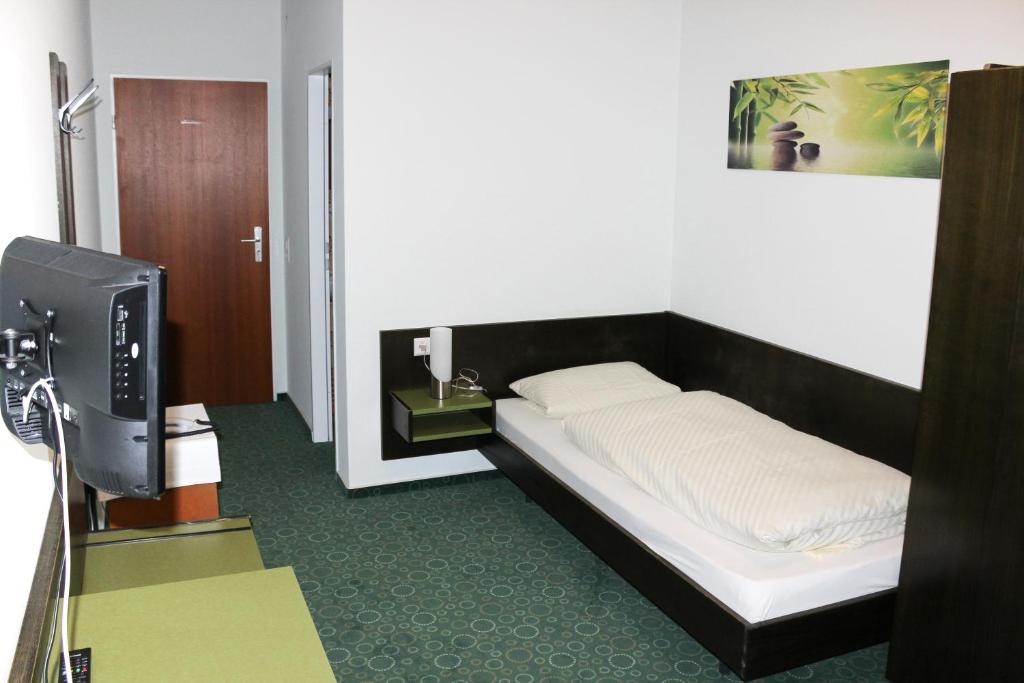 Postel nebo postele na pokoji v ubytování Gasthof Krone