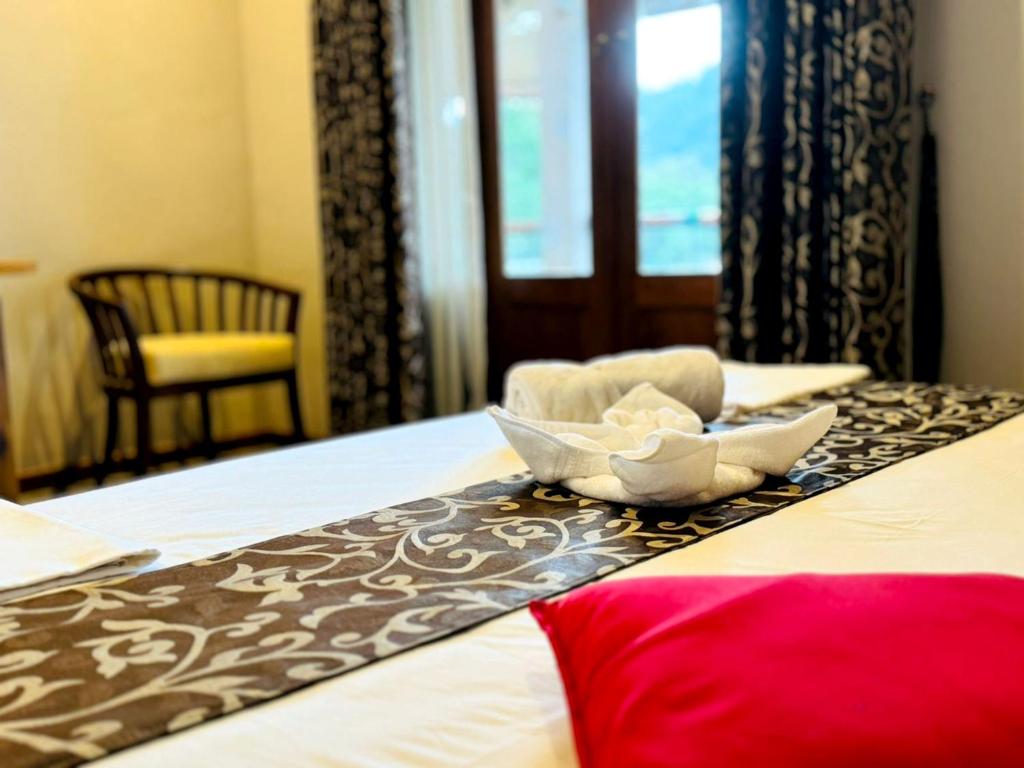 Postel nebo postele na pokoji v ubytování Rivorich Residence Kandy