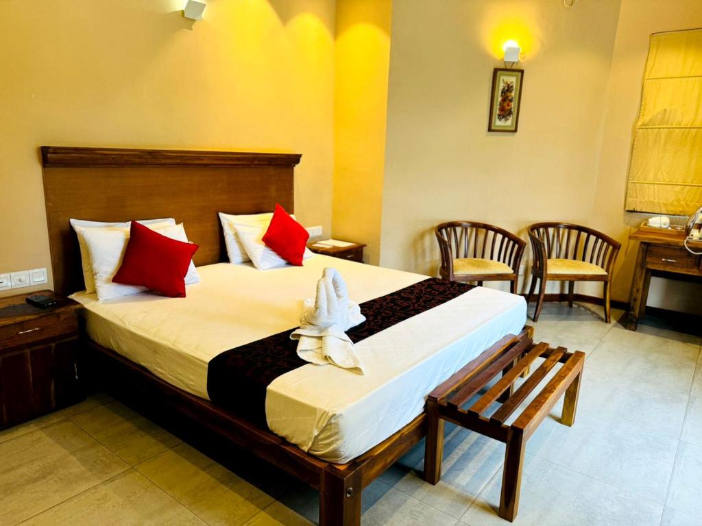 Postel nebo postele na pokoji v ubytování Rivorich Residence Kandy