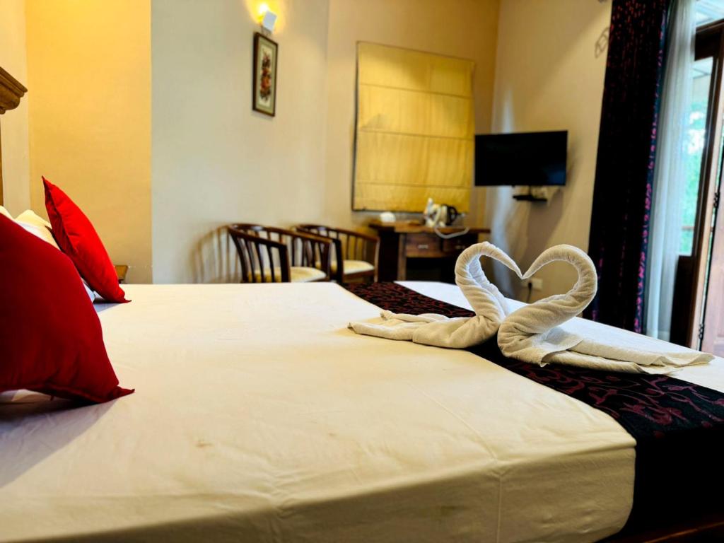 Postel nebo postele na pokoji v ubytování Rivorich Residence Kandy