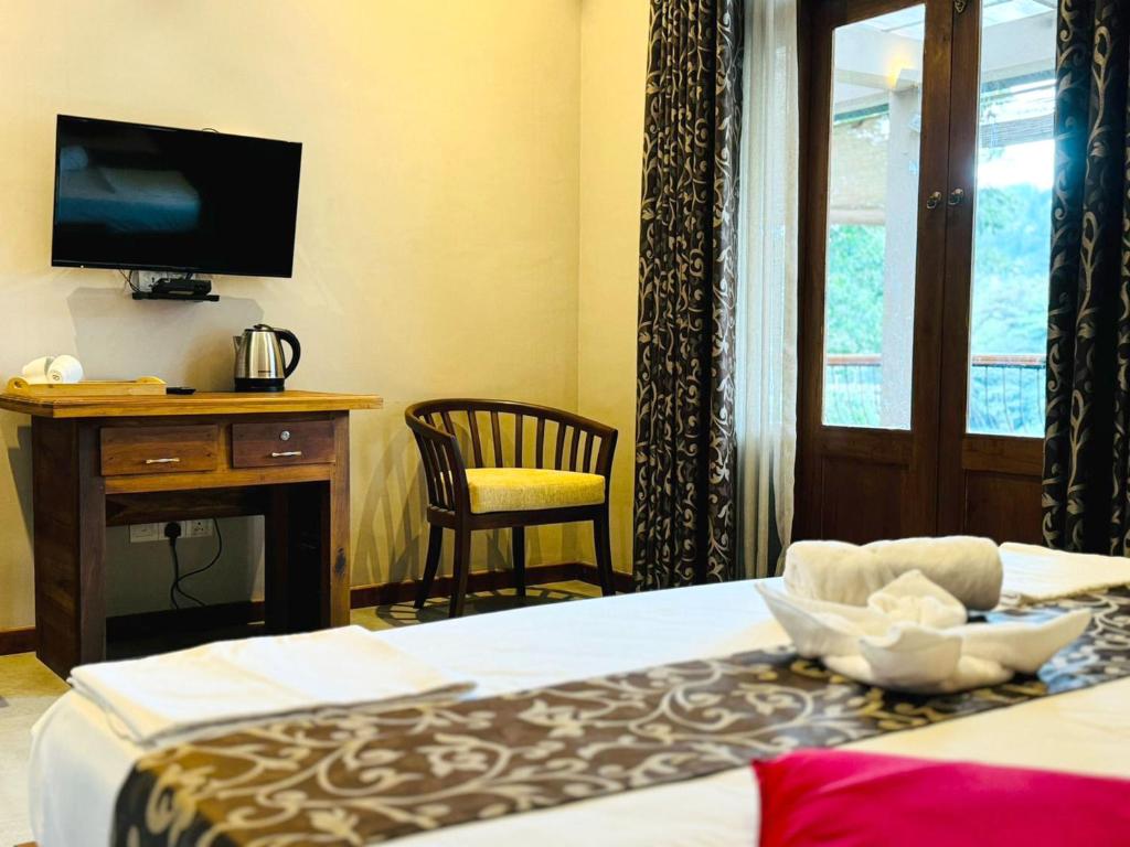 Postel nebo postele na pokoji v ubytování Rivorich Residence Kandy