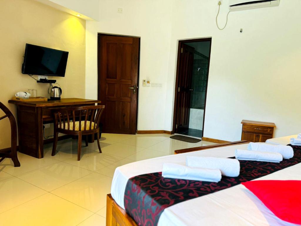 Postel nebo postele na pokoji v ubytování Rivorich Residence Kandy