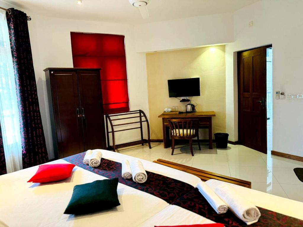 Postel nebo postele na pokoji v ubytování Rivorich Residence Kandy