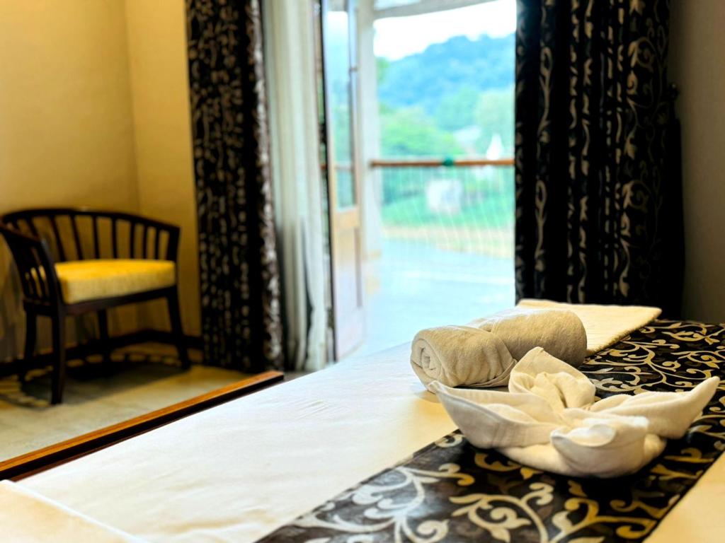 Postel nebo postele na pokoji v ubytování Rivorich Residence Kandy
