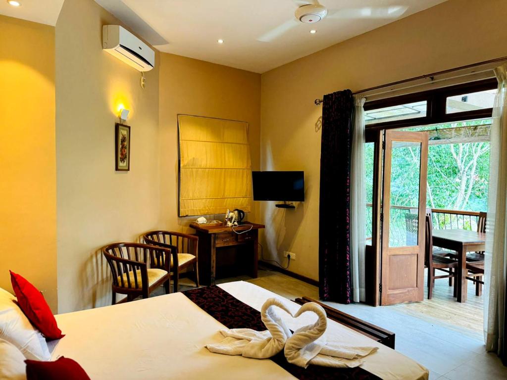 TV a/nebo společenská místnost v ubytování Rivorich Residence Kandy