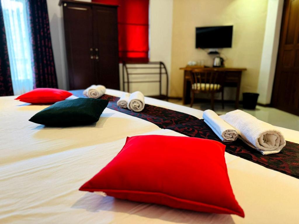 Postel nebo postele na pokoji v ubytování Rivorich Residence Kandy