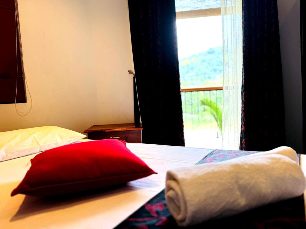 Postel nebo postele na pokoji v ubytování Rivorich Residence Kandy