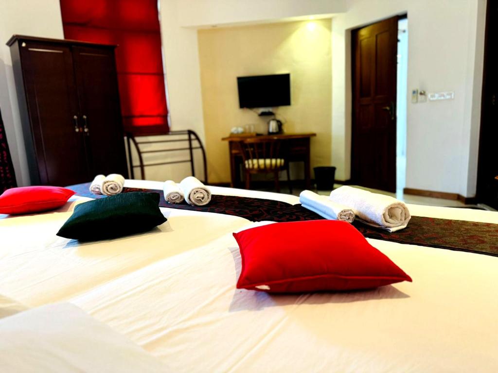 Postel nebo postele na pokoji v ubytování Rivorich Residence Kandy