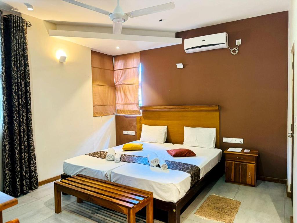Postel nebo postele na pokoji v ubytování Rivorich Residence Kandy