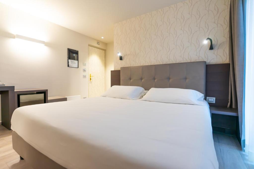 Postel nebo postele na pokoji v ubytování Hotel Belvedere Wellness&SPA