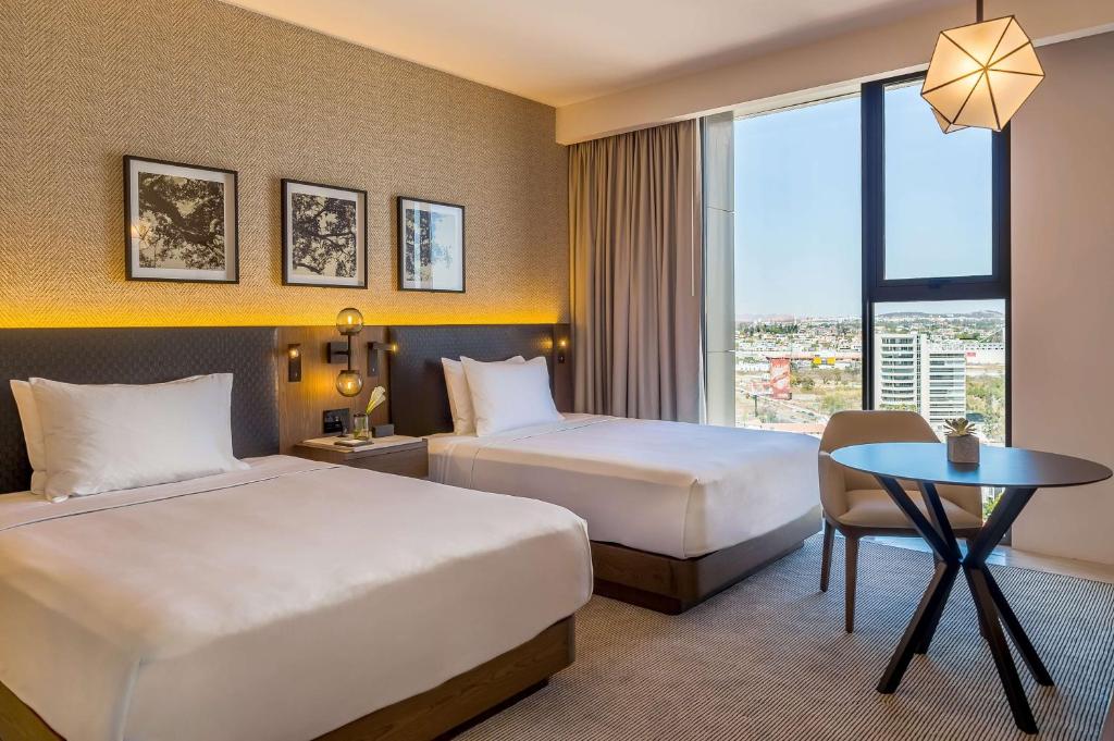 Postel nebo postele na pokoji v ubytování Hyatt Regency Andares Guadalajara