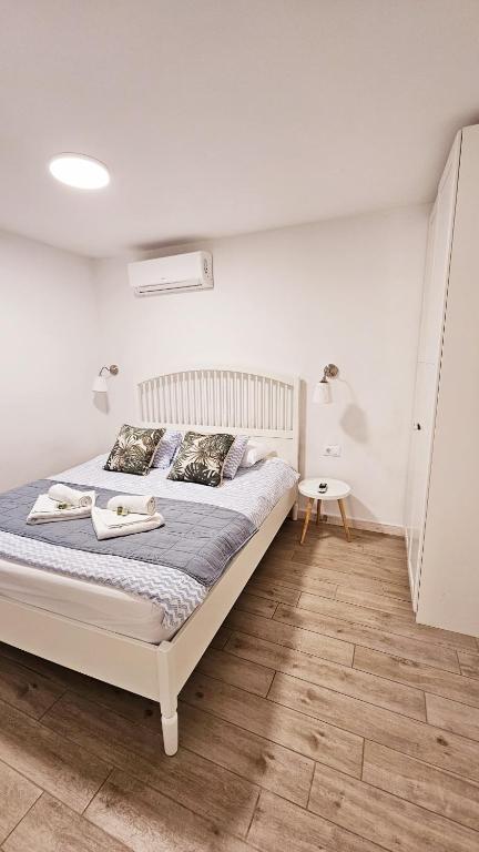 Posteľ alebo postele v izbe v ubytovaní Guesthouse Augusta Insula