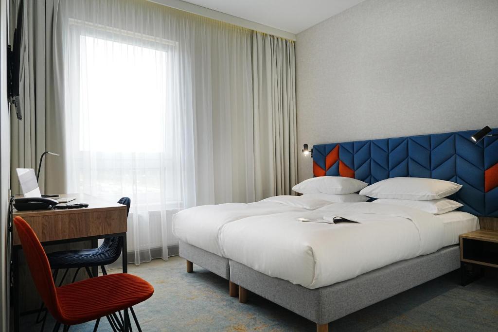 Postel nebo postele na pokoji v ubytování Hotel Faros Gdansk Airport