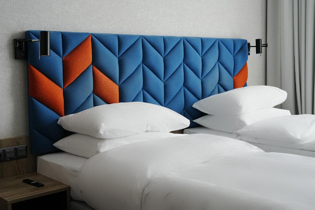 Postel nebo postele na pokoji v ubytování Hotel Faros Gdansk Airport