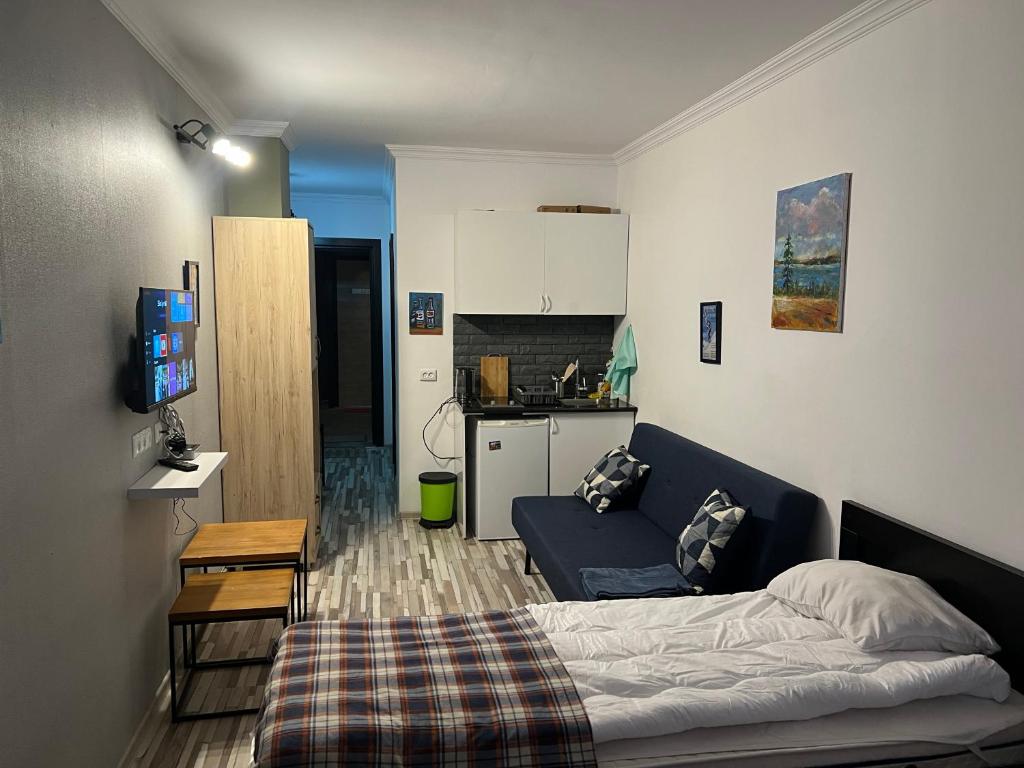Postel nebo postele na pokoji v ubytování Gudauri loft Apartment 509