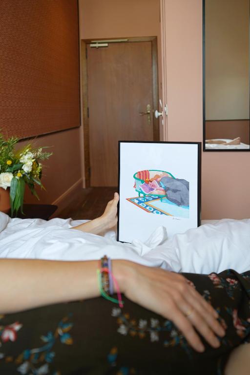 Postel nebo postele na pokoji v ubytování Hôtel Littéraire Stendhal et Spa
