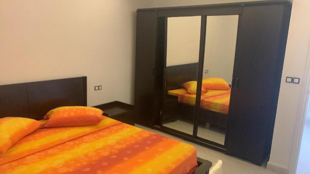 Postel nebo postele na pokoji v ubytování 5min de la zone touristique 400metre de la plage appartement chic S plus 1