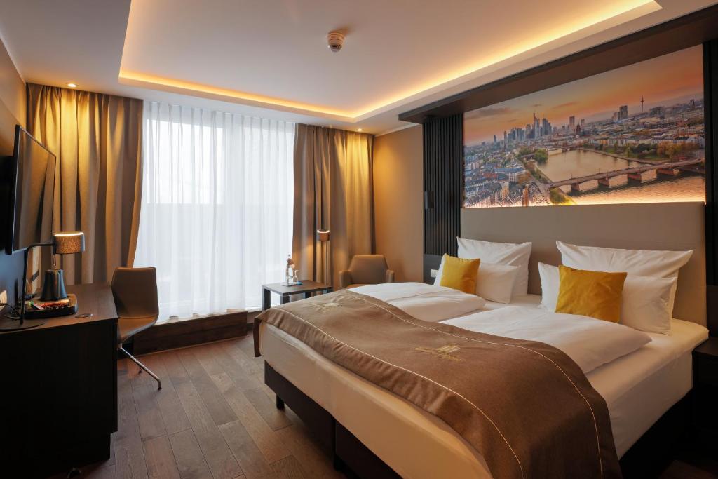 Postel nebo postele na pokoji v ubytování Skyline Hotel City Frankfurt