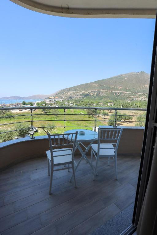 a balcony with a table and chairs and a view at Sole Luna Hotel in Borsh