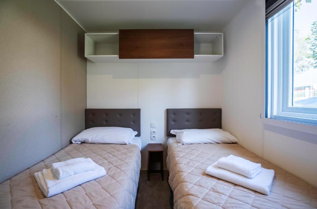 Postel nebo postele na pokoji v ubytování Camping Lido Verbano