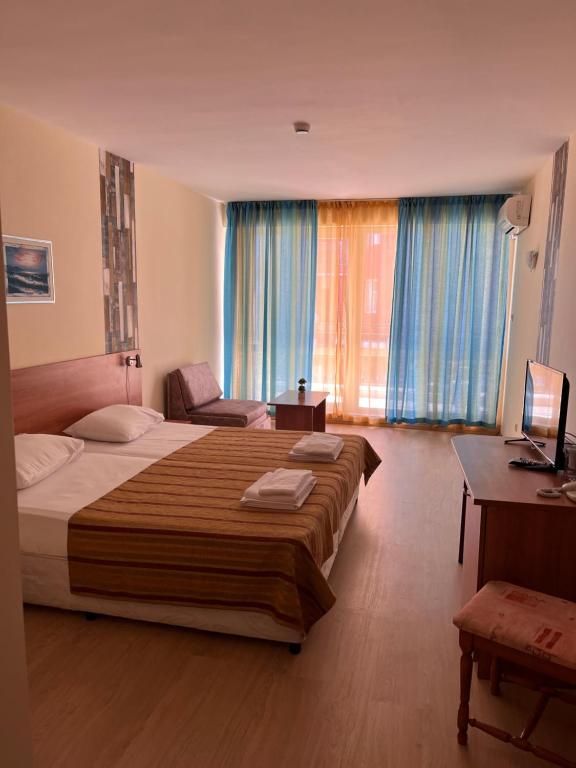 Postel nebo postele na pokoji v ubytování Hotel Star